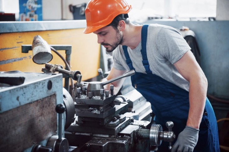 portrait-young-worker-hard-hat-large-waste-recycling-factory-1-1