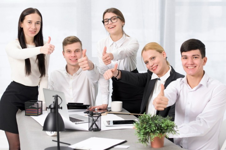 smiling-portrait-businesspeople-showing-thumb-up-sign-1-1